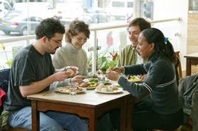 GEN people eating in a restaurant