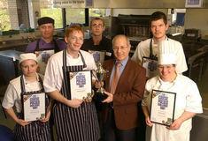 David Walker, in tie, presents certifcates to chefs in the pub challenge