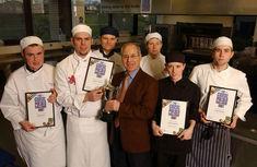 Walker presents Compton with trophy, surrounded by other contestants from the student world