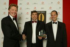 Hart Worldwide chief operating officer John Potter, centre, and executive chairman Daniel Hart, right receive their Sunday Times Award from the newspaper's managing editor Richard Caseby.