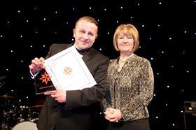Radoslaw Kozlowski recieves his award from Lynda Armstrong of the BSC SMALL
