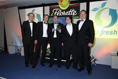 Neil Gibson, Budgens category manager, Steve Normington, Budgens trading manager and Paul Morgan, Budgens trading manager collect the award from QV's Simon Martin and Quentin Willson (either side)