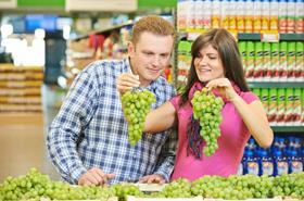 Consumers shopping for grapes