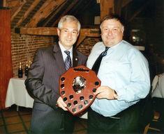 Clive Edmed (r) is presented with the Tesco shield by Martin de la Fuente