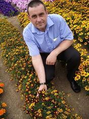 T&M professional growers manager Nigel Judd at the trials site this week with ‘Mr Majestic’ - with highly contrasting striped flowers.