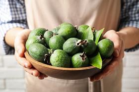 Feijoa (person holding bowl of feijoas