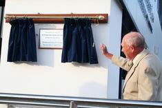 Norman Collett unveils a plaque to mark the opening of the eponymous company's new premises