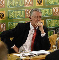A pensive minister takes flak from the floor