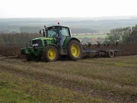 Tractor ploughing field