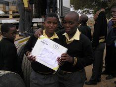 South African schoolchildren receive a School-Aid shipment from Capespan and partners