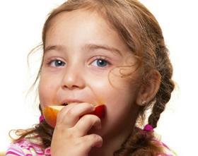 child eating apple