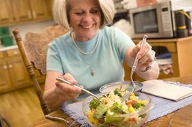 Woman eating salad