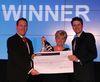 Val Newman collecting her award