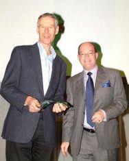 Peter Bradford (left) from Fresh and Wild collects the award for Best Retailer from Ron Stagg Brunel Healthcare