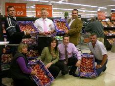 Theresa Huxley and Neil Gibson from Sainsbury's, centre, with Kent top-fruit growers