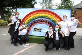 NHS staff at Royal Orthopaedic Hospital in Birmingham enjoying the sunshine and rainbow made entirley out of salad to mark NHS Frontline Day