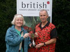 Kieran Devine of Wight Salads accepting the Len Summerton Cup for the tastiest tomato from Len's daughter Kate Armes, at the West Dean Totally Tomato Show 2008
