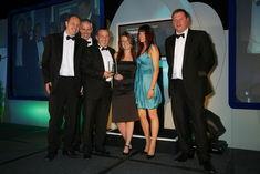 The co-op posse accept their Multiple Retailer of the Year award from QV Foods sales and marketing director Simon Martin