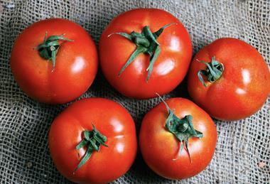Cherry tomatoes on cloth Adobe Stock