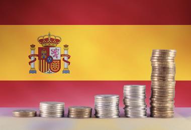 Spain flag money stacked Adobe Stock