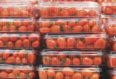 Tomatoes in unbranded clear plastic punnets