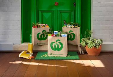 Three Woolworths grocery bags delivered to customers home