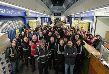 Wholesalers congregate for a final portrait in the original Buyers' Walk at New Covent Garden Market