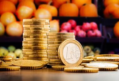 Euro coins in front of fresh produce