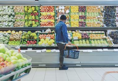 Supermarket shopper browsing fresh produce Adobe Stock