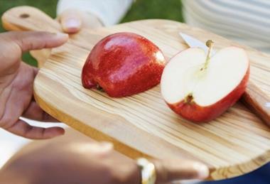 Envy apples on wooden board sliced Oppy