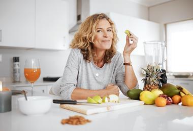 Woman eating apple slices