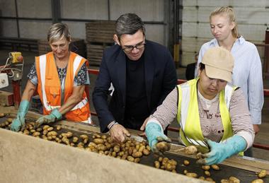 Andy Burnham inspects potatoes at FG Pryor & Son