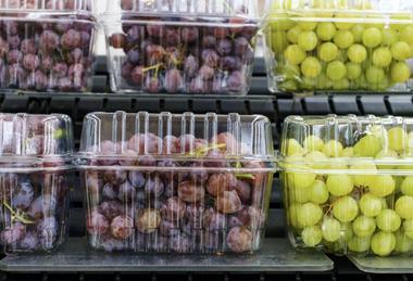 Grapes in punnets on supermarket shelves Adobe Stock