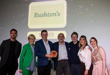 The Rushton's team accepts its award