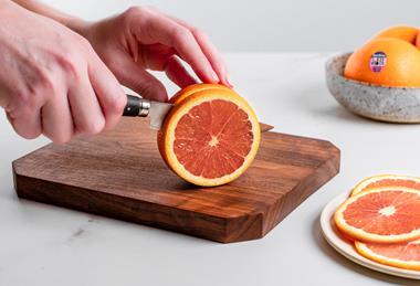 Cara Cara oranges being sliced Sunkist