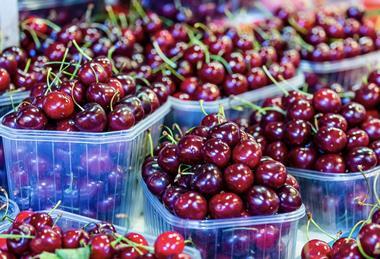 Cherries at a market in Barcelona Spain Adobe Stock