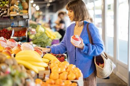 Lady buying bananas