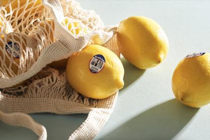 Sunkist lemons tumbling from bag