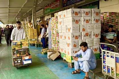 Workers busy at the wholesale market in Dubai