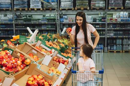 GEN US healthy eating supermarket mum daughter AdobeStock_590636842