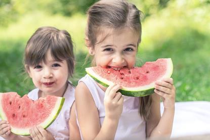 Children eating watermelon Adobe Stock