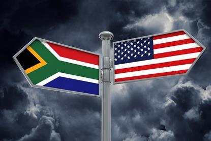 South Africa US signpost flags stormclouds Adobe Stock