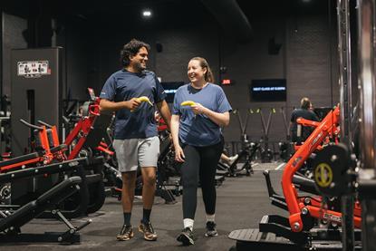Two gym goers with bananas