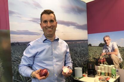 William Findlay (left) showing off the new variety at Fruit Logistica with his father Alastair in the background