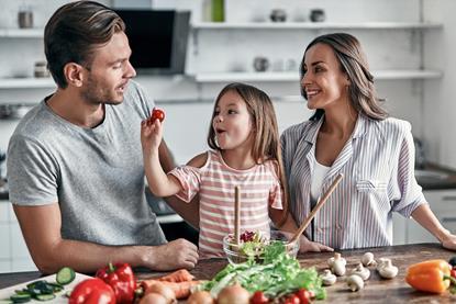 Family preparing healthy meal kitchen