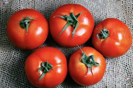 Cherry tomatoes on cloth Adobe Stock