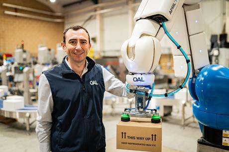 Jake Norman with one of OAL's fenceless robots