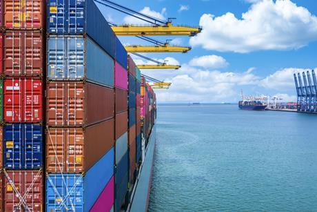 Generic side of container vessel at port Adobe Stock