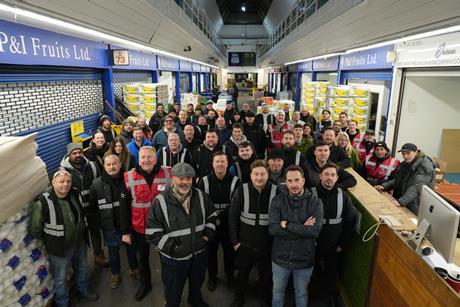 Wholesalers congregate for a final portrait in the original Buyers' Walk at New Covent Garden Market