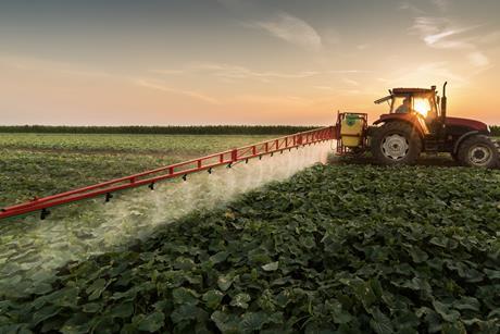 Tractor spraying vegetables Adobe Stock